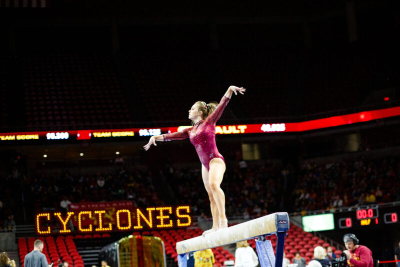 NCAA Gymnast, Phoebe Turner, on Beam representing the Iowa State University Cyclones. 